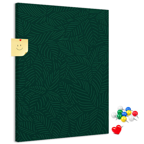 Cork notice board Background with leaves on a dark green background