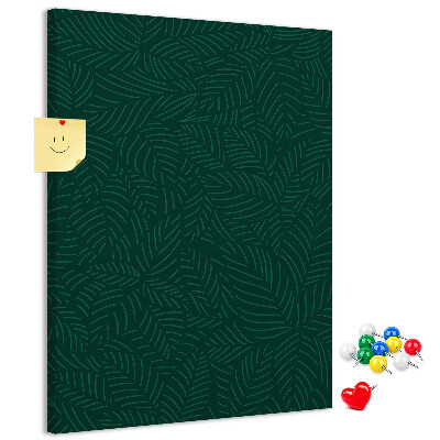 Cork notice board Background with leaves on a dark green background