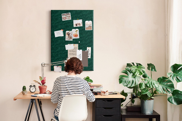 Cork notice board Background with leaves on a dark green background