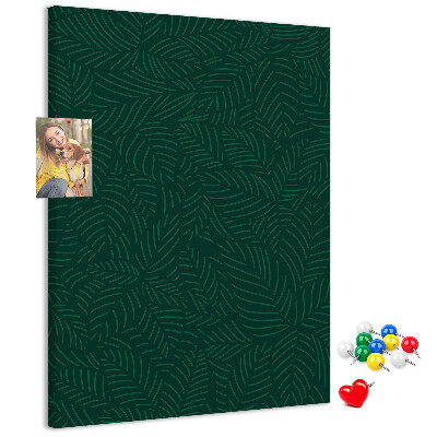 Cork notice board Background with leaves on a dark green background