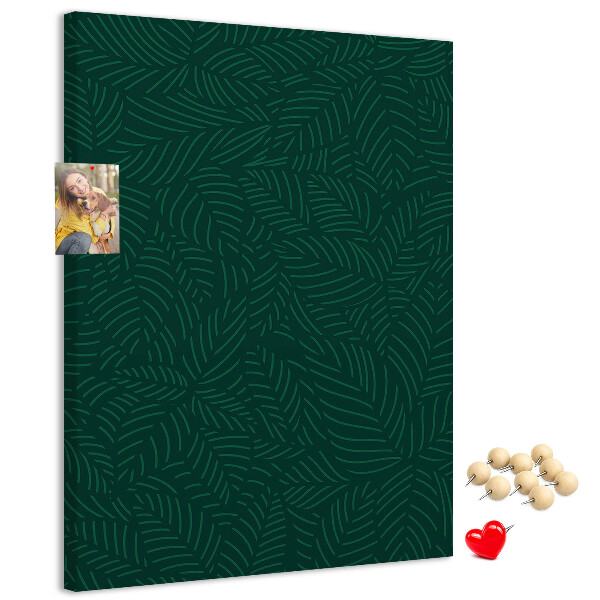 Cork notice board Background with leaves on a dark green background