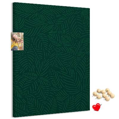 Cork notice board Background with leaves on a dark green background