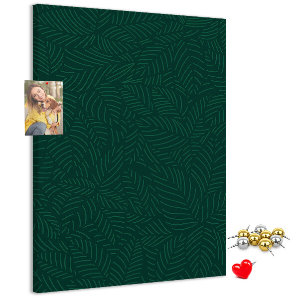 Cork notice board Background with leaves on a dark green background