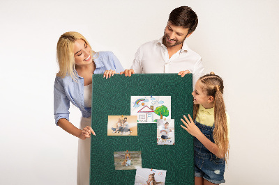 Cork notice board Background with leaves on a dark green background