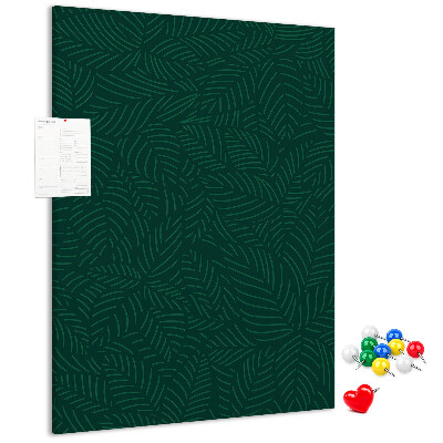 Cork notice board Background with leaves on a dark green background