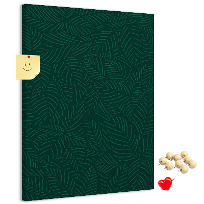 Cork notice board Background with leaves on a dark green background