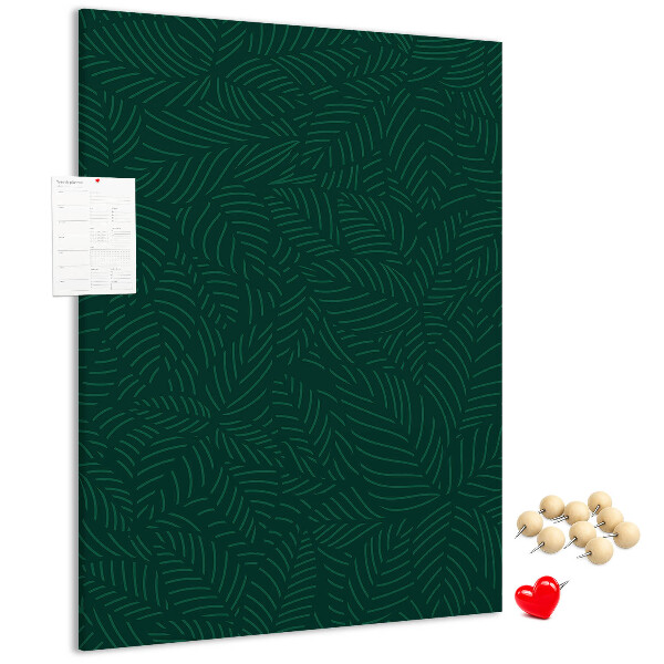 Cork notice board Background with leaves on a dark green background