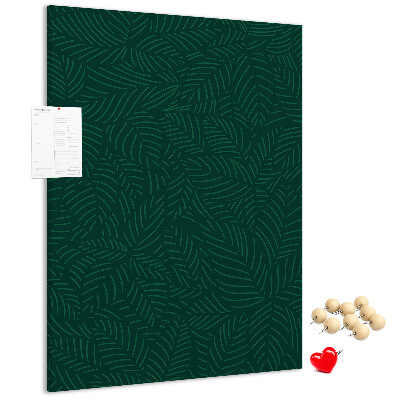 Cork notice board Background with leaves on a dark green background