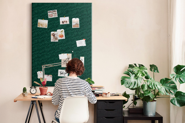 Cork notice board Background with leaves on a dark green background