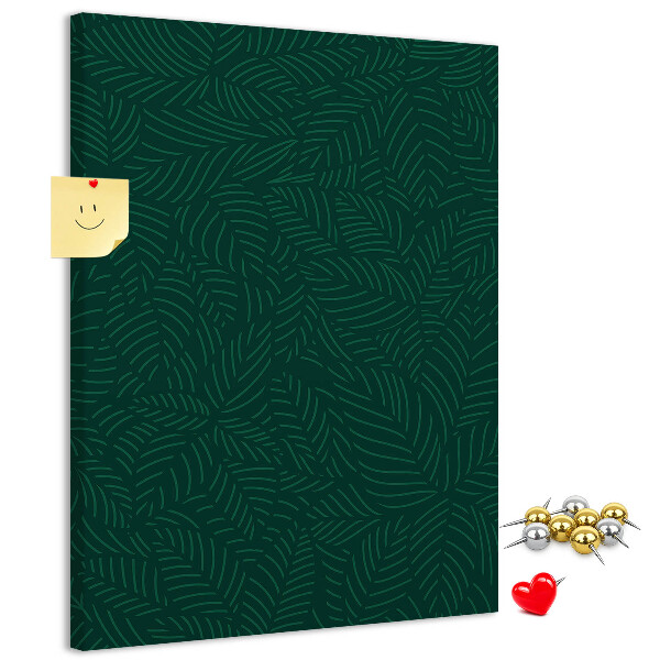 Cork notice board Background with leaves on a dark green background