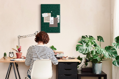 Cork notice board Background with leaves on a dark green background
