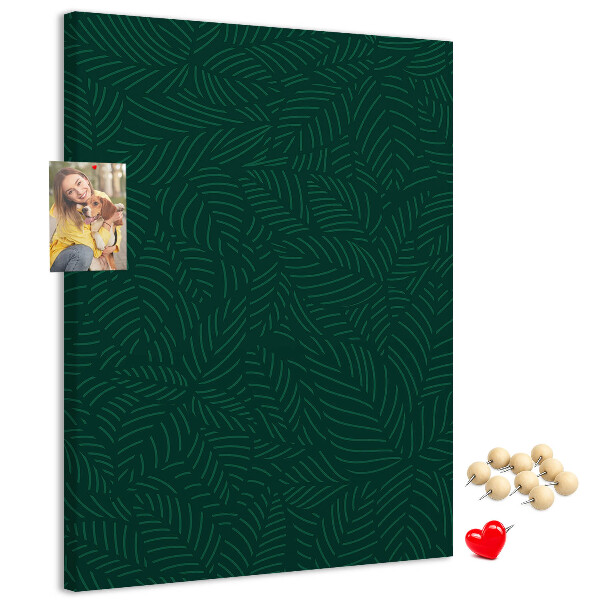 Cork notice board Background with leaves on a dark green background