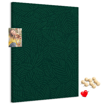 Cork notice board Background with leaves on a dark green background