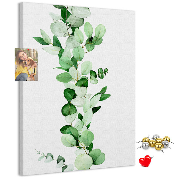 Cork notice board Green leaves on a light background