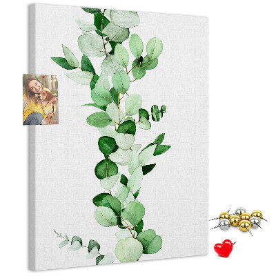 Cork notice board Green leaves on a light background