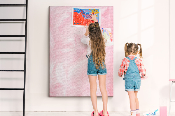 Wall cork memo board Delicate pink feathers on the background