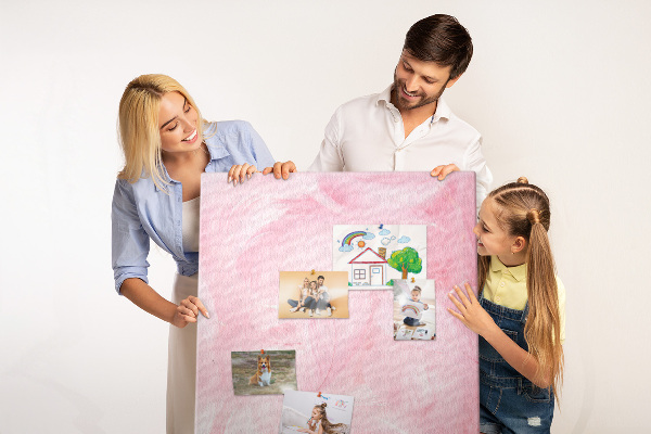 Wall cork memo board Delicate pink feathers on the background