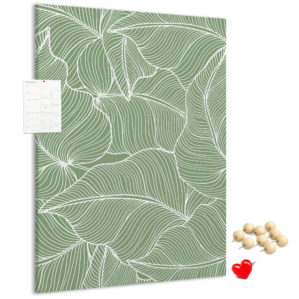 Cork notice board Delicate leaves on a green background