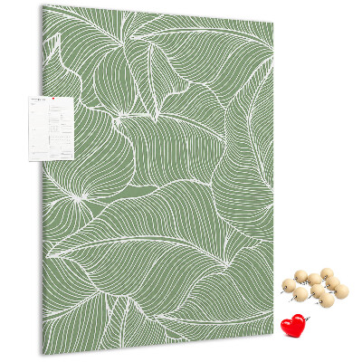 Cork notice board Delicate leaves on a green background