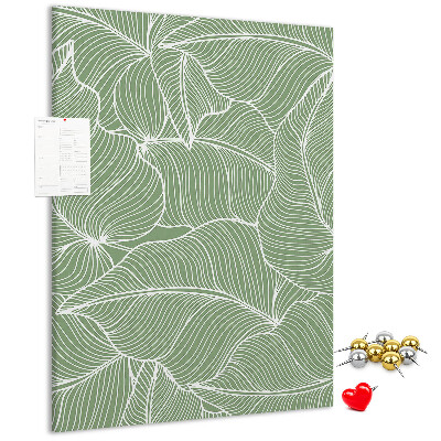 Cork notice board Delicate leaves on a green background