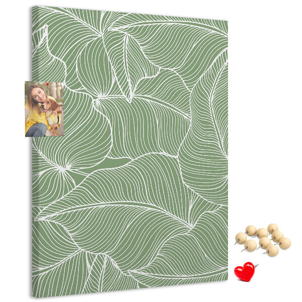 Cork notice board Delicate leaves on a green background