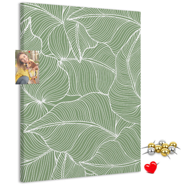 Cork notice board Delicate leaves on a green background