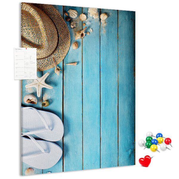Pin board Summer accessories on a blue wood background