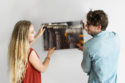Magnetic board with glass bottles