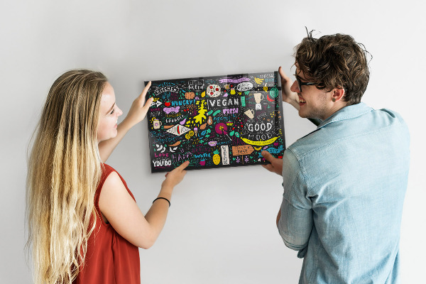 Magnetic board for wall with an abstract inscription design