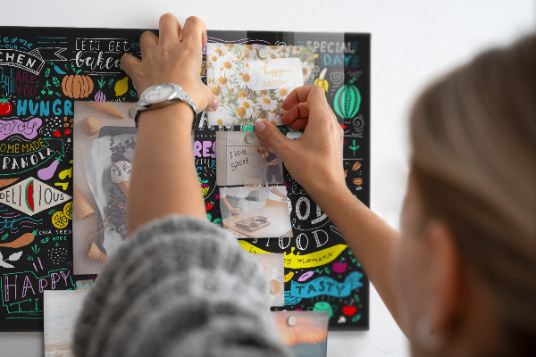 Magnetic board for wall with an abstract inscription design