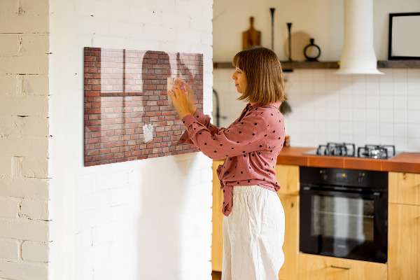 Dry erase board magnetic A note board on a brick wall