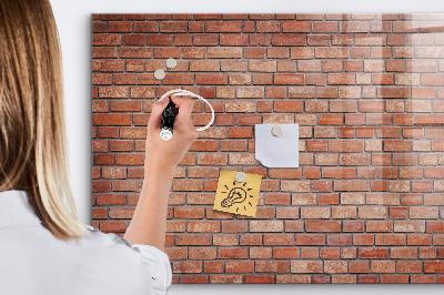 Dry erase board magnetic A note board on a brick wall