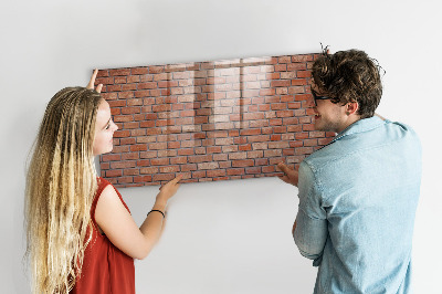 Dry erase board magnetic A note board on a brick wall
