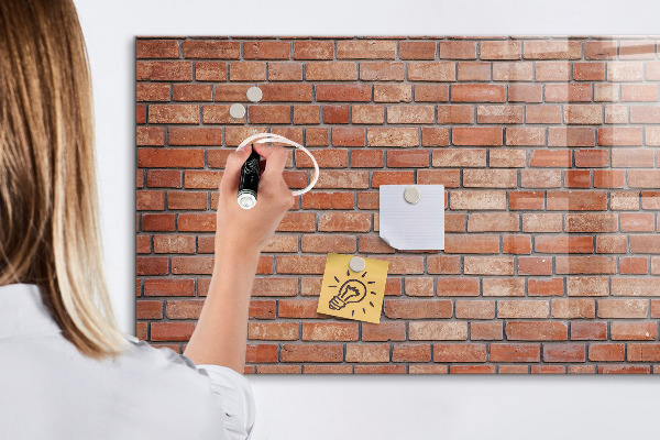 Dry erase board magnetic A note board on a brick wall