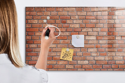 Dry erase board magnetic A note board on a brick wall