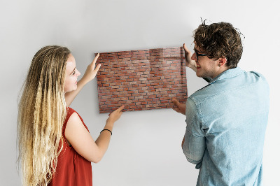 Dry erase board magnetic A note board on a brick wall