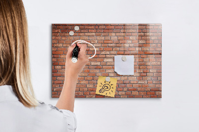 Dry erase board magnetic A note board on a brick wall