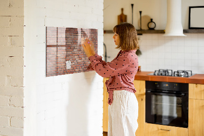 Dry erase board magnetic A note board on a brick wall