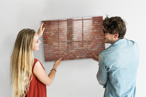 Dry erase board magnetic A note board on a brick wall
