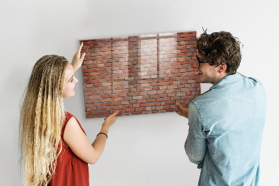 Dry erase board magnetic A note board on a brick wall