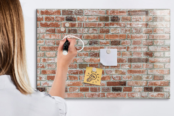 Dry erase board magnetic Photo board on a brick wall
