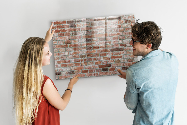Dry erase board magnetic Photo board on a brick wall