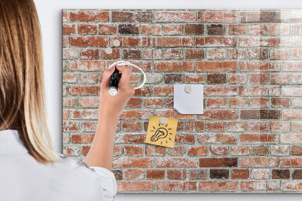 Dry erase board magnetic Photo board on a brick wall