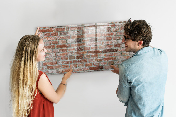 Dry erase board magnetic Photo board on a brick wall