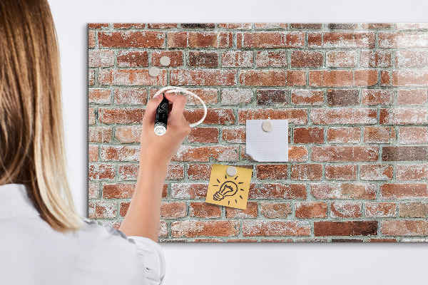 Dry erase board magnetic Photo board on a brick wall