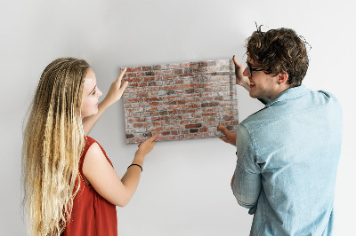 Dry erase board magnetic Photo board on a brick wall