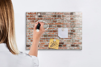 Dry erase board magnetic Photo board on a brick wall
