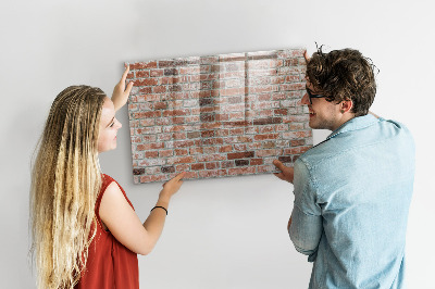 Dry erase board magnetic Photo board on a brick wall