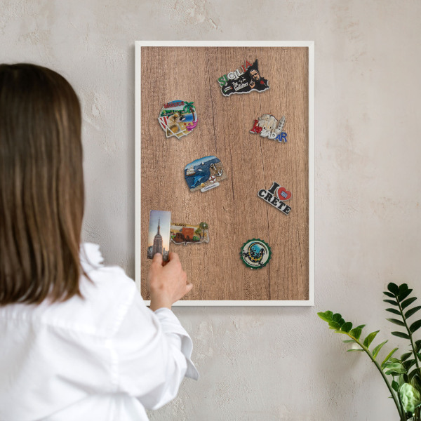Magnetic board for travel magnets in a white frame Wood texture