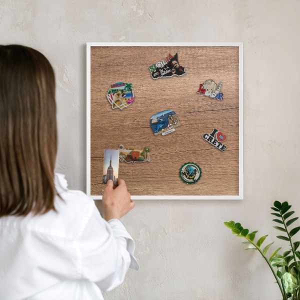 Magnetic board for travel magnets in a white frame Wood texture